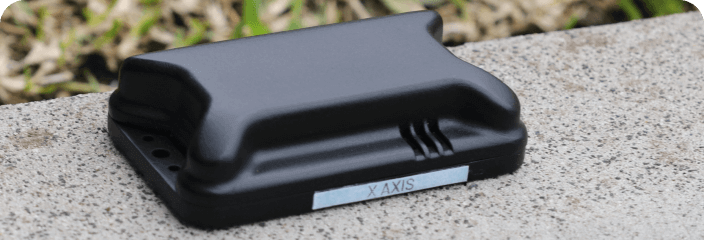 LevelTag leveling sensor device placed outdoors showing X axis for accurate tilt measurement and vehicle leveling