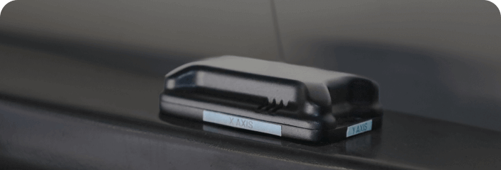 LevelTag smart leveling sensor device mounted on surface for precision measurement and alignment with X and Y axis labels